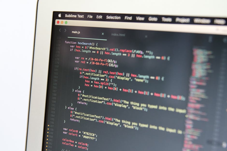 A computer screen displaying a code editor with JavaScript code related to web development, featuring syntax highlighting and line numbers. The code includes functions and conditional statements, with